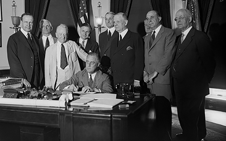 Stock photo of President Roosevelt signing the Glass-Steagall Act