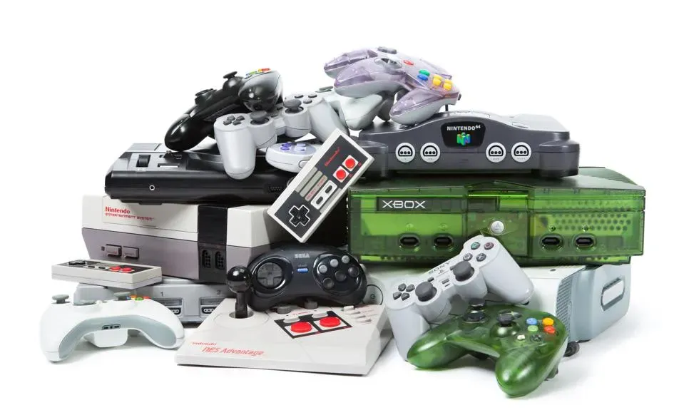 A pile of gaming consoles